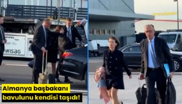 Almanya başbakanı bavulunu kendisi taşıdı!